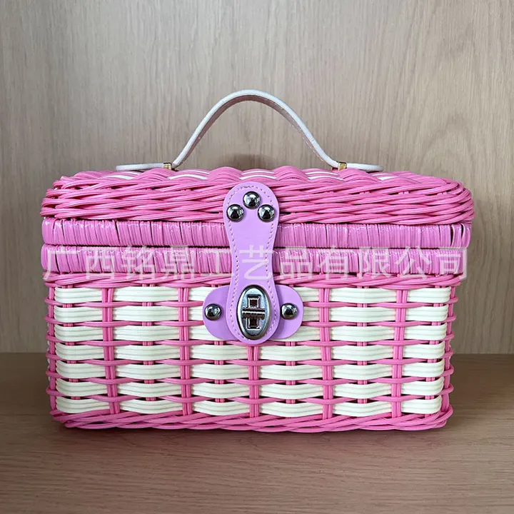 Band-Woven Mini Lidded Case — Compact two-tone lidded case with rounded corners, an arched handle and secure front clasp, available in multiple color combinations.