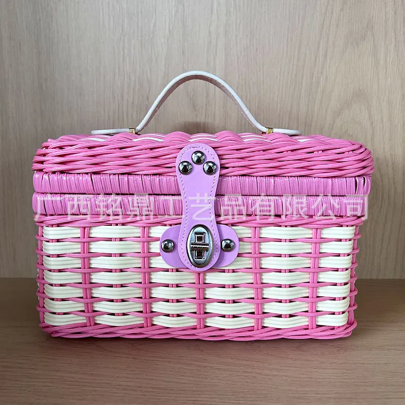 Band-Woven Mini Lidded Case — Compact two-tone lidded case with rounded corners, an arched handle and secure front clasp, available in multiple color combinations.