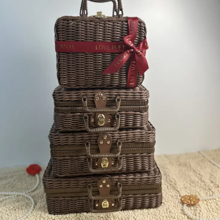 Dark Ribbon-Trimmed Carry Case I — Dark rectangular carry case with a flat lid, top handle, front clasp and coordinated ribbon trim for premium gift programs.